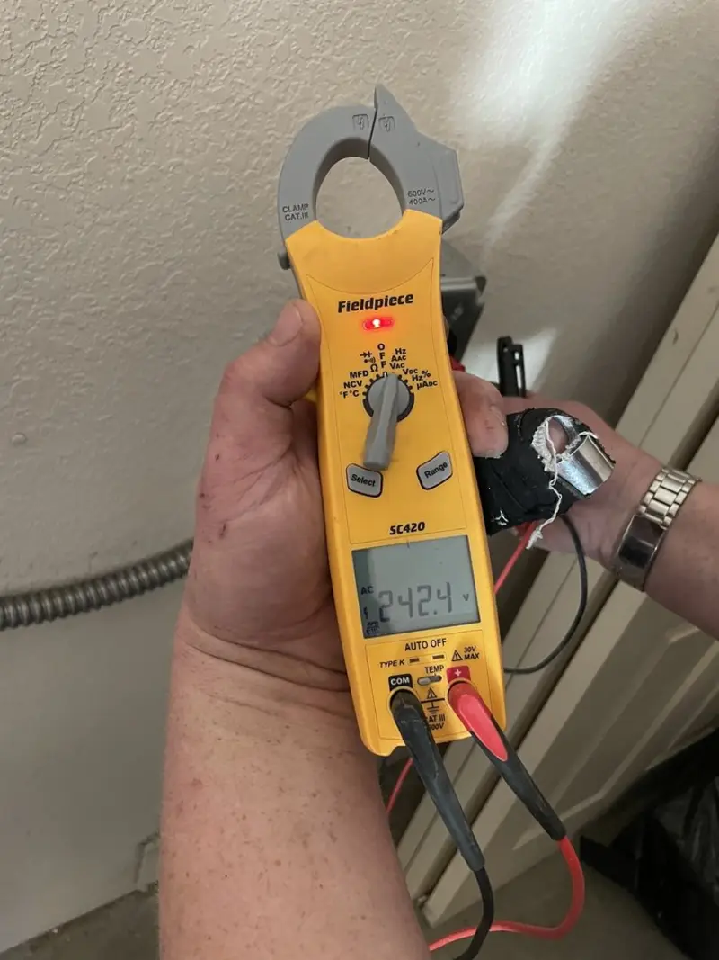 Voltage testing with clamp meter during Ceiling Fan Installation in Miramar
